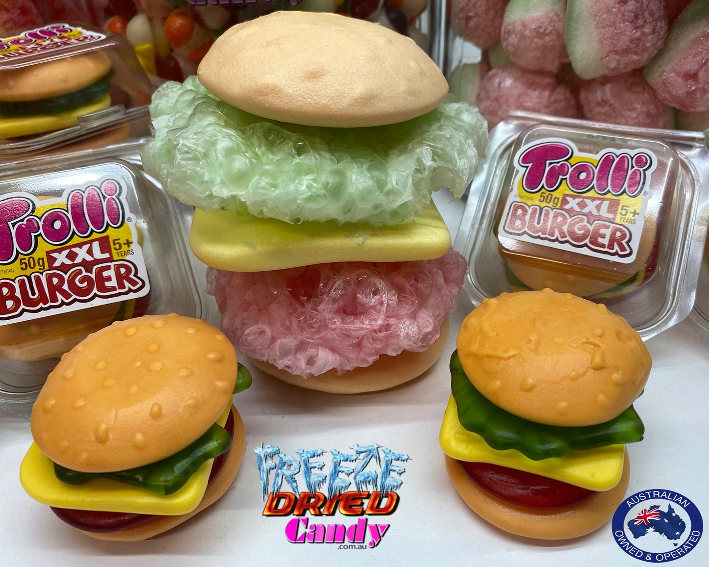 Freeze Dried XXL Burger by Trolli | Freeze Dried Candy Lollies Sweets treats. Turns from XXL to a Massive Gaint Crunchy Puffy Burger, and oh so tasty. Made up of five delicious layers: a bread roll top, salad, cheese, meat, and a bottom bread bun. Each layer is separated and has a different color and fruit flavor. combinations of rhubarb, raspberry, strawberry, pineapple-kiwi-gooseberry with a touch of yoghurt and cream. No-one can resist their original flavour. Bite into one now!