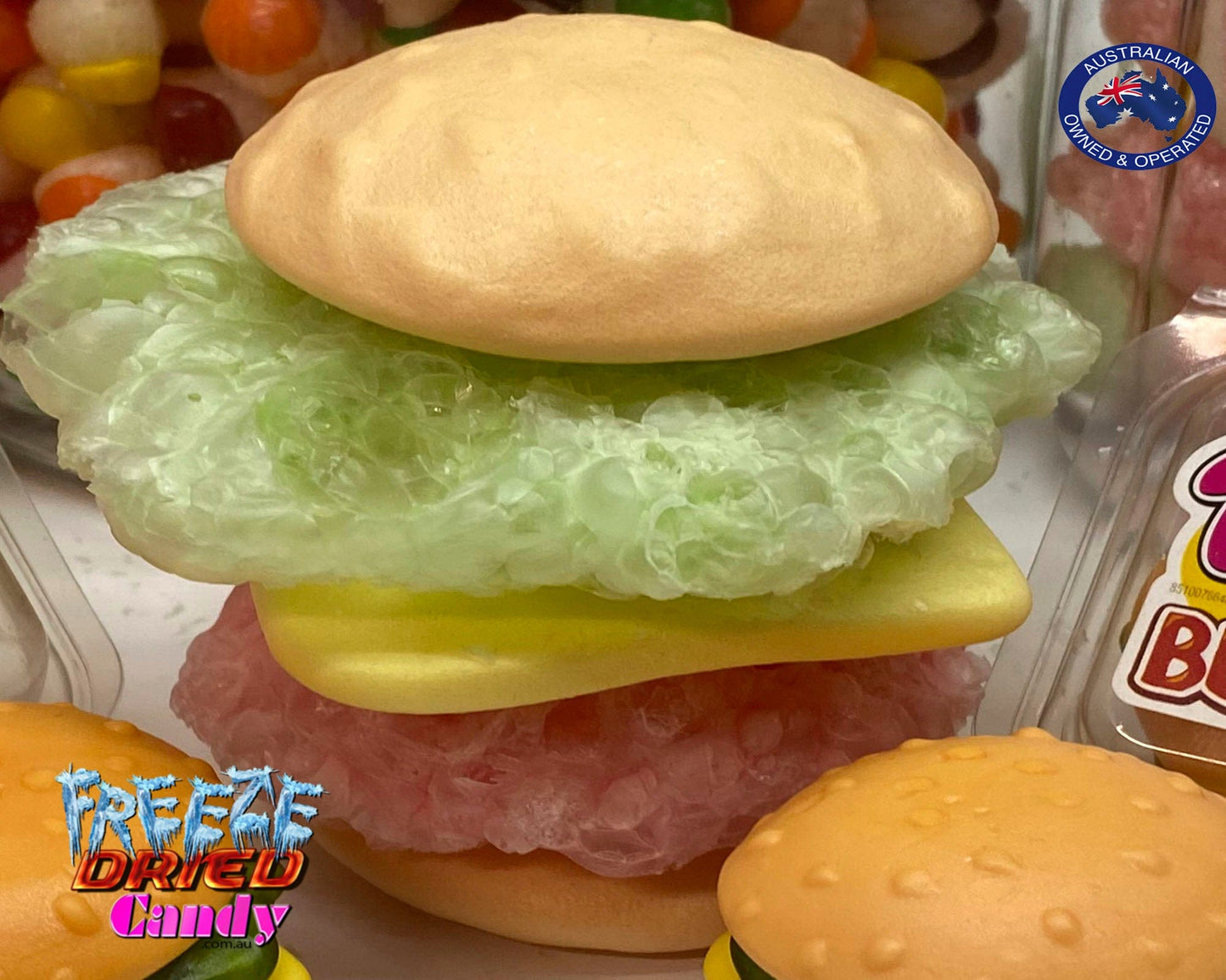 Freeze Dried XXL Burger by Trolli | Freeze Dried Candy Lollies Sweets treats. Turns from XXL to a Massive Gaint Crunchy Puffy Burger, and oh so tasty. Made up of five delicious layers: a bread roll top, salad, cheese, meat, and a bottom bread bun. Each layer is separated and has a different color and fruit flavor. combinations of rhubarb, raspberry, strawberry, pineapple-kiwi-gooseberry with a touch of yoghurt and cream. No-one can resist their original flavour. Bite into one now!