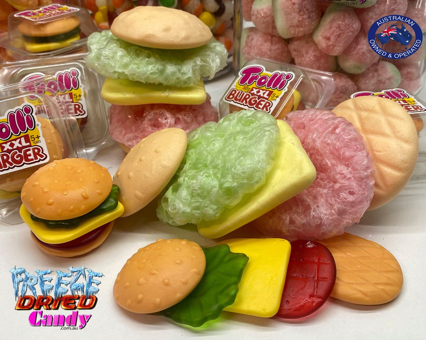 Freeze Dried  XXL Burger by Trolli | Freeze Dried Candy Lollies Sweets treats. Turns from XXL to a Massive Gaint Crunchy Puffy Burger, and oh so tasty.  Made up of five delicious layers: a bread roll top, salad, cheese, meat, and a bottom bread bun. Each layer is separated and has a different color and fruit flavor. combinations of rhubarb, raspberry, strawberry, pineapple-kiwi-gooseberry with a touch of yoghurt and cream. No-one can resist their original flavour. Bite into one now!